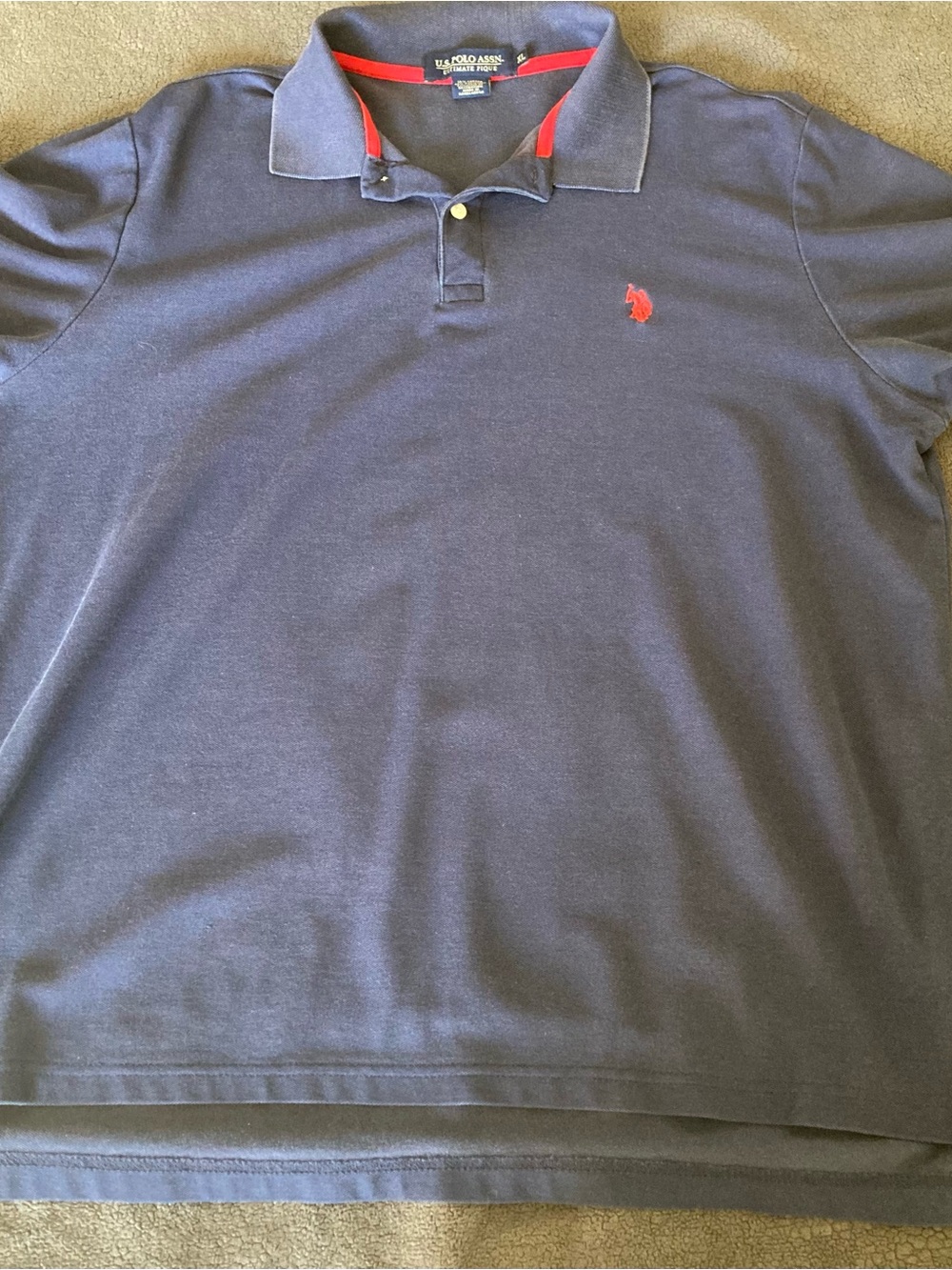 U.S. Polo Assn. navy polo with red logo and red collar trim